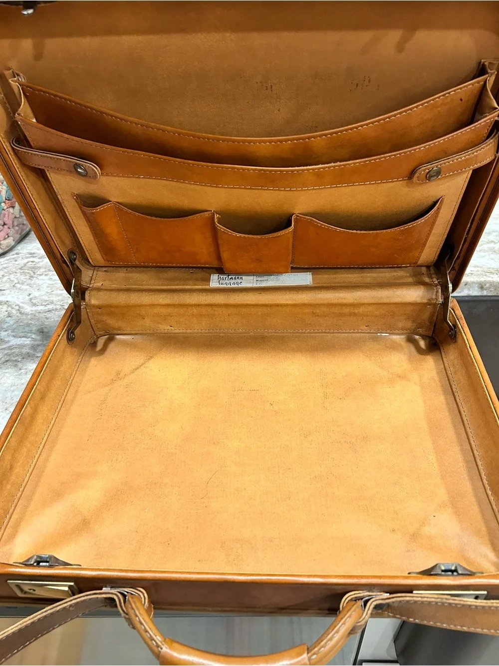 Men’s Hartman Tan Leather briefcase with padded handle.